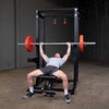 Body Solid SPR500 half rack black with pull-up bar, j-hooks, safety spotter arms  red bumper plates