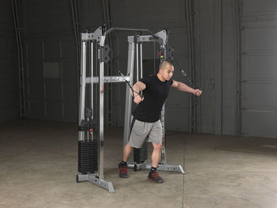 Body-Solid GDCC210 functional trainer dual weight stacks pull-up bar silver and black chest flys