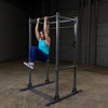 woman doing knee ups on powerline power rack ppr1000
