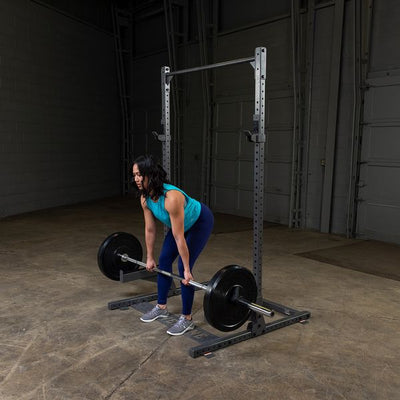 woman doing rack pulls on ppr500 using safety spotter arms